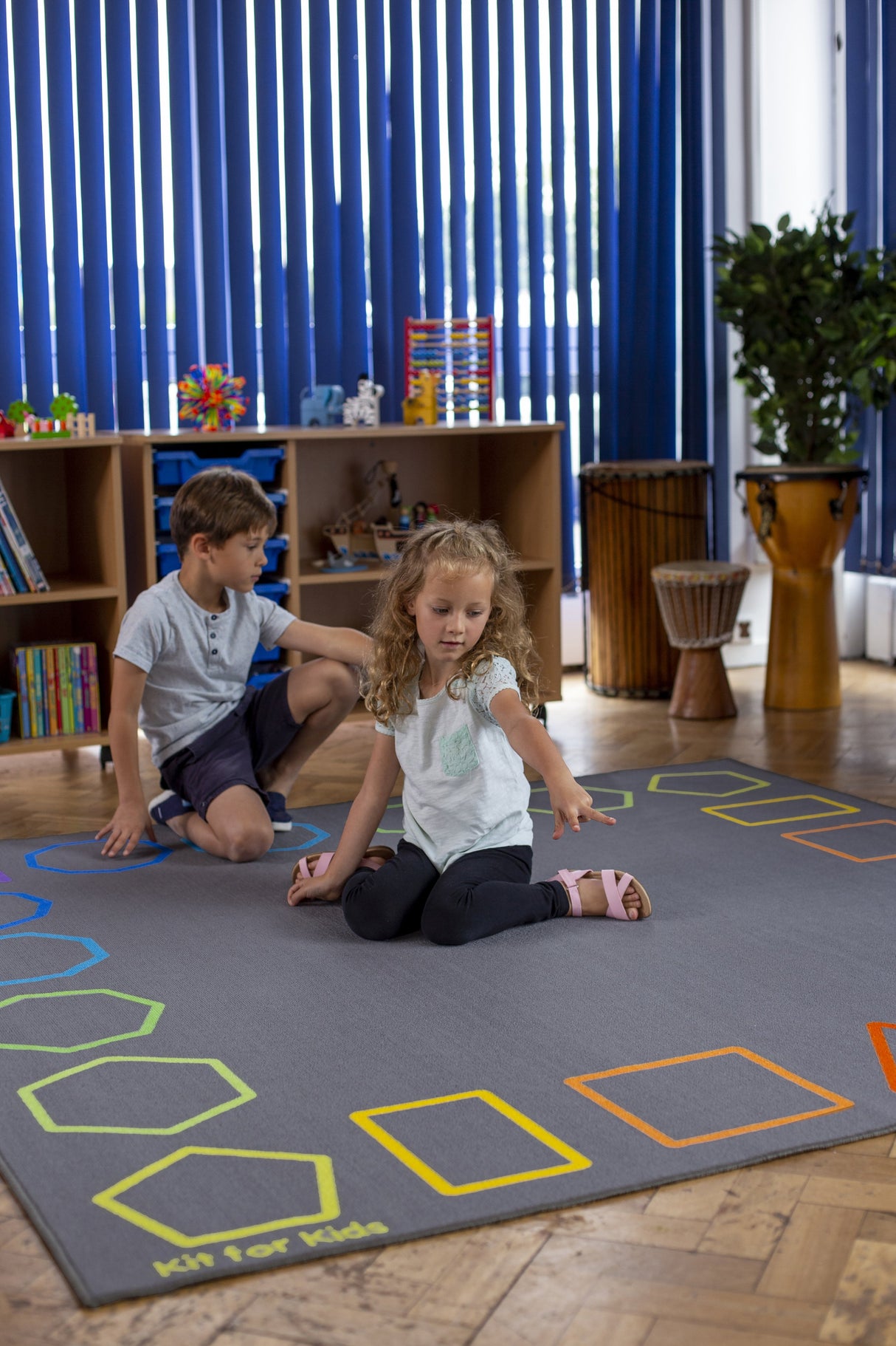 Essentials™ Rainbow Geometric Border Carpet